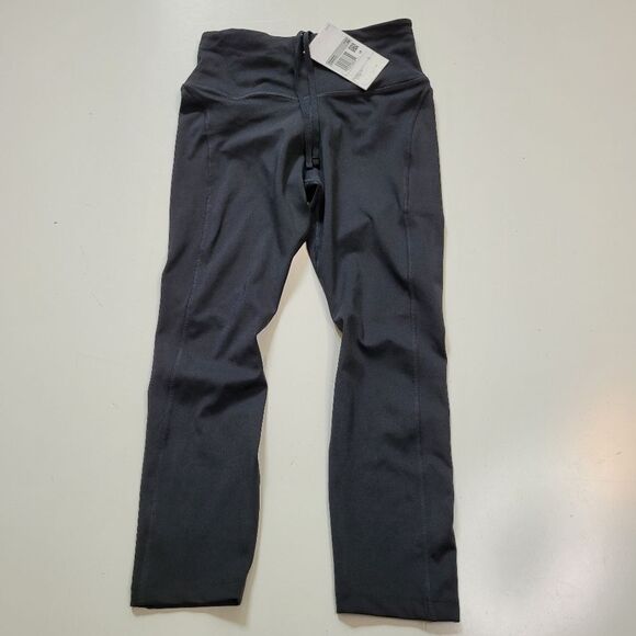 NEW NIKE FAST DRI-FIT BLACK MID RISE CROPPED LEGGINGS TIGHTS ZIP POCKETS XS NWT - Picture 1 of 10